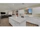 Open concept kitchen with a large island, seamlessly flowing into the living area at 3217 Bonassola Ave, North Las Vegas, NV 89031