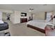 Large primary bedroom with carpet flooring, a ceiling fan, and a flat-screen television at 3217 Bonassola Ave, North Las Vegas, NV 89031