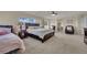 Spacious main bedroom boasts natural light, ceiling fan, sitting area, and en suite bathroom access at 3217 Bonassola Ave, North Las Vegas, NV 89031