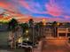 Neighborhood street view at sunset, showcasing the vibrant cityscape in the distance at 3217 Bonassola Ave, North Las Vegas, NV 89031