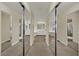 Large walk-in closet features mirrored doors, storage, and seamless access to en suite bathroom at 3217 Bonassola Ave, North Las Vegas, NV 89031