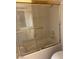 Shower with glass doors plus tiled surround with gold toned fixtures, creating an elegant look at 3394 Brookfield Dr, Las Vegas, NV 89120