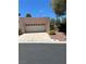 Charming single-story home with a two-car garage and desert landscaping at 3394 Brookfield Dr, Las Vegas, NV 89120