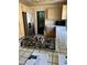 Kitchen featuring gas cooktop, stainless refrigerator, and tile countertops at 3394 Brookfield Dr, Las Vegas, NV 89120