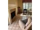 Living room featuring tile floors, brick fireplace, and natural light at 3394 Brookfield Dr, Las Vegas, NV 89120