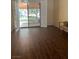 Bright room with sliding doors to patio; features hard wood floors, neutral paint, and great natural light at 3394 Brookfield Dr, Las Vegas, NV 89120