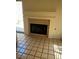Living room featuring tile floors, brick fireplace, and natural light at 3394 Brookfield Dr, Las Vegas, NV 89120