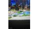 View of a community water feature with lush plants, shrubs, and trees creating a serene outdoor scene at 3394 Brookfield Dr, Las Vegas, NV 89120