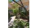 Lush side yard with mature trees and greenery providing a tranquil outdoor space at 3394 Brookfield Dr, Las Vegas, NV 89120