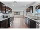 Kitchen featuring granite countertops, stainless appliances, and wood-look floors at 3412 Tabor Ave, North Las Vegas, NV 89030