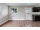 Bright living room features wood-look flooring and a modern window for natural light at 3412 Tabor Ave, North Las Vegas, NV 89030