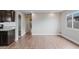 Open floor plan connecting living room to kitchen, showcasing modern flooring at 3412 Tabor Ave, North Las Vegas, NV 89030