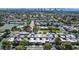 Aerial view of property showcasing proximity to community pool, tennis courts, and the Las Vegas skyline at 3553 Kensbrook St, Las Vegas, NV 89121