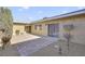 Private brick patio and backyard features a sliding glass door entrance to the residence at 3553 Kensbrook St, Las Vegas, NV 89121