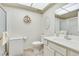 Bathroom featuring a vanity area, a shower, floral wallpaper, and neutral carpeting at 3553 Kensbrook St, Las Vegas, NV 89121