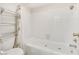 Bathroom features a tiled shower-over-tub with built-in bench and convenient towel storage at 3553 Kensbrook St, Las Vegas, NV 89121