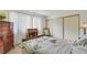 Bedroom featuring sliding closet door, ample furniture, and lots of natural light at 3553 Kensbrook St, Las Vegas, NV 89121