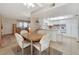 Open dining area next to kitchen features white cabinets and great natural light at 3553 Kensbrook St, Las Vegas, NV 89121