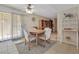 Inviting dining space with a sliding glass door leading to the backyard and a view of the kitchen area at 3553 Kensbrook St, Las Vegas, NV 89121