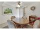 Charming dining area with a wooden table, four chairs, and a bright and airy atmosphere at 3553 Kensbrook St, Las Vegas, NV 89121