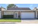 Charming single-story home with an attached garage and well-maintained landscaping in a quiet neighborhood at 3553 Kensbrook St, Las Vegas, NV 89121