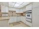Bright kitchen featuring tile floors, stainless steel appliances, and ample cabinet space at 3553 Kensbrook St, Las Vegas, NV 89121