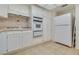 Bright kitchen featuring tile floors, stainless steel appliances, and ample cabinet space at 3553 Kensbrook St, Las Vegas, NV 89121