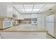 Bright kitchen featuring tile floors, stainless steel appliances, and ample cabinet space at 3553 Kensbrook St, Las Vegas, NV 89121