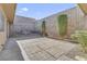 Private brick patio area with mature landscaping provides a tranquil outdoor space to relax at 3553 Kensbrook St, Las Vegas, NV 89121
