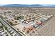 Scenic aerial photo showcases a neighborhood with diverse homes and landscaping, set in a picturesque desert environment at 3640 E Vineyard Dr, Pahrump, NV 89048