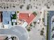 Aerial view of a home with a red tile roof in a desert landscape at 3640 E Vineyard Dr, Pahrump, NV 89048