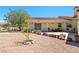 Spacious backyard with potted plants, mature landscaping, and covered patio at 3640 E Vineyard Dr, Pahrump, NV 89048