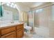 Bathroom featuring a single vanity, toilet, and combination bathtub and shower with a curtain at 3640 E Vineyard Dr, Pahrump, NV 89048