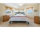 Bedroom with natural light streaming from several windows and a ceiling fan at 3640 E Vineyard Dr, Pahrump, NV 89048