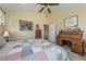 Bedroom featuring unique decor, ceiling fan, and views into the hallway at 3640 E Vineyard Dr, Pahrump, NV 89048