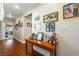 Hallway featuring beautiful wood flooring and decoratively adorned with Gathering photos at 3640 E Vineyard Dr, Pahrump, NV 89048