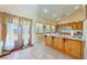 Bright kitchen with center island and a garden view from the french doors at 3640 E Vineyard Dr, Pahrump, NV 89048