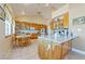 Spacious kitchen with vaulted ceilings, ample cabinet space and a cozy breakfast nook at 3640 E Vineyard Dr, Pahrump, NV 89048
