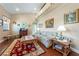Comfortable living room with hardwood floors, bright windows and eclectic decor at 3640 E Vineyard Dr, Pahrump, NV 89048