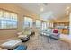 Bright living room featuring tile floors and mountain views from the many windows at 3640 E Vineyard Dr, Pahrump, NV 89048
