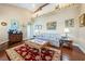 Comfortable living room with hardwood floors, a patterned rug and eclectic decor at 3640 E Vineyard Dr, Pahrump, NV 89048