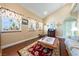 Comfortable living room with hardwood floors, bright windows and eclectic decor at 3640 E Vineyard Dr, Pahrump, NV 89048