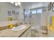 Bright bathroom with granite counters, a shower-tub combo and modern fixtures at 368 Umbria Way, Henderson, NV 89014