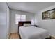 Comfortable bedroom features neutral colors, hardwood floors, and natural light from the window at 368 Umbria Way, Henderson, NV 89014