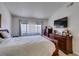 Bright bedroom featuring natural light and wood furniture including dresser and headboard at 368 Umbria Way, Henderson, NV 89014