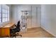 Cozy bedroom with neutral walls, hardwood floors, and a closet with sliding doors at 368 Umbria Way, Henderson, NV 89014