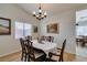 Cozy dining room with wood floors and natural light is a perfect place to share a meal with friends at 368 Umbria Way, Henderson, NV 89014