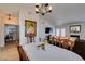 Open-concept living and dining space featuring a fireplace and hardwood floors at 368 Umbria Way, Henderson, NV 89014