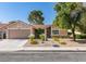 Charming single-story home features desert landscaping and attached two-car garage at 368 Umbria Way, Henderson, NV 89014