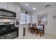 Charming kitchen nook with tile floors, table with chairs and stainless steel appliances at 368 Umbria Way, Henderson, NV 89014